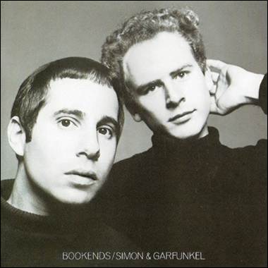 A couple of men posing for a picture
Description automatically generated