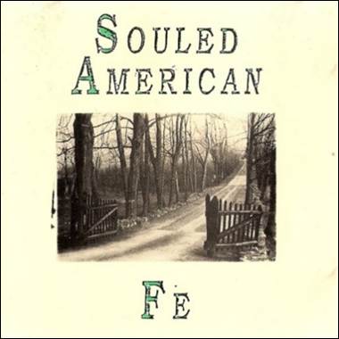 A gate and trees on a road
Description automatically generated