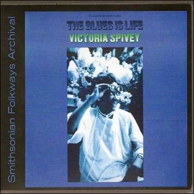 A cd cover with a person in a white shirt
Description automatically generated