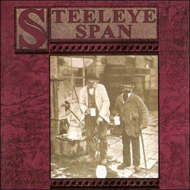 A group of men standing in front of a sign
Description automatically generated