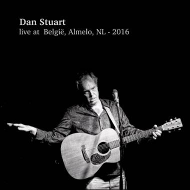 A person holding a guitar
Description automatically generated