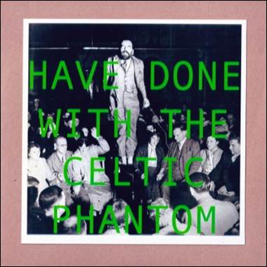 A person standing on a stage with a crowd of people

Description automatically generated