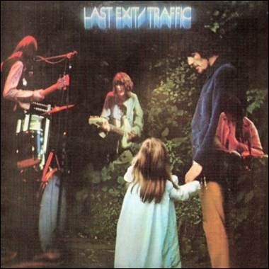 A group of people standing in front of a child playing instruments

Description automatically generated