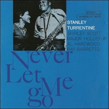 A blue cover with a couple of people
Description automatically generated