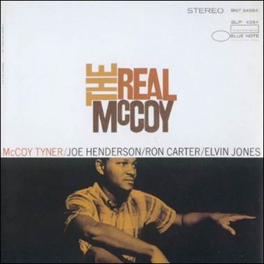 A person sitting on a white cover
Description automatically generated