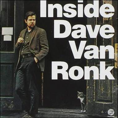 A person standing in front of a door with a cat
Description automatically generated