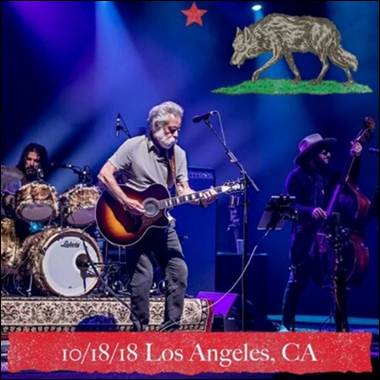 A group of people playing instruments on a stage
Description automatically generated