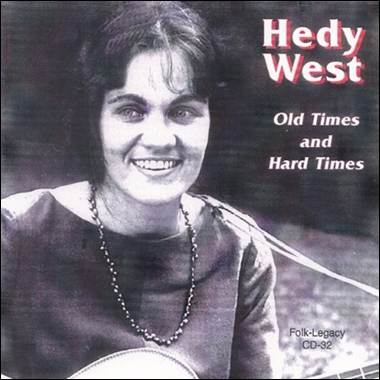 A person smiling with a guitar
Description automatically generated