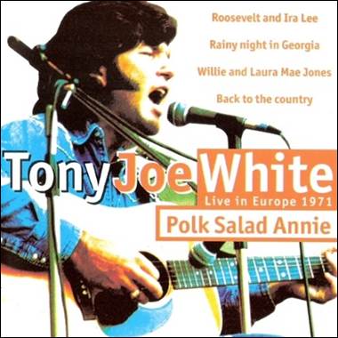 A person singing into microphones
Description automatically generated