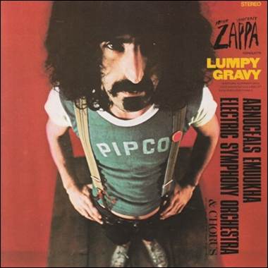 A person with long black hair and a mustache
Description automatically generated