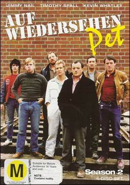 A group of men standing in front of a brick wall

Description automatically generated