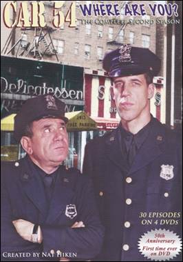 A couple of police officers in front of a building

Description automatically generated