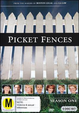 A white fence with several pictures of people

Description automatically generated