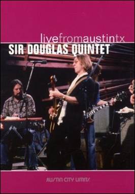 A person playing guitar on a stage

Description automatically generated