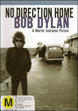 A person standing on a road with a car in the background

Description automatically generated