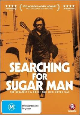 A person walking with a guitar

Description automatically generated