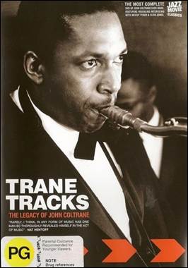 A person in a suit with a saxophone
Description automatically generated