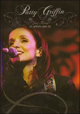 A person singing into a microphone
Description automatically generated