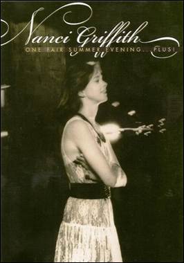 A person in a dress with her arms crossed
Description automatically generated