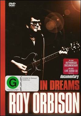 A person holding a guitar
Description automatically generated