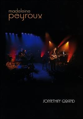 A band performing on stage
Description automatically generated