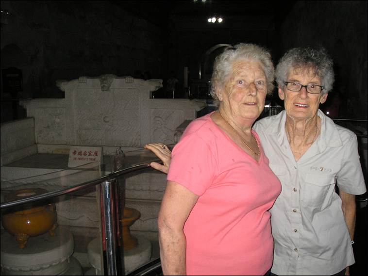 A couple of women standing next to a glass railing

AI-generated content may be incorrect.
