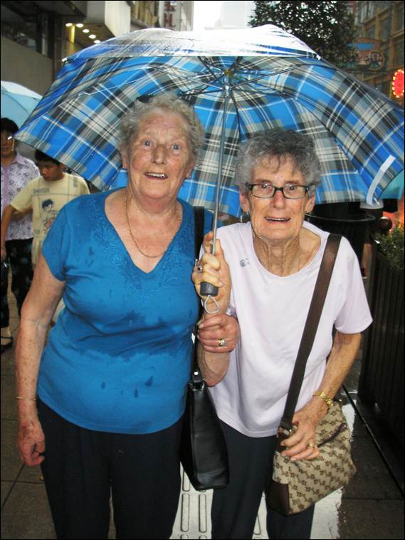 A couple of older women under an umbrella

AI-generated content may be incorrect.
