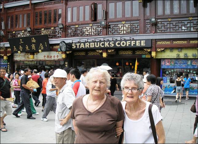 A group of people standing in front of a starbucks coffee shop

AI-generated content may be incorrect.