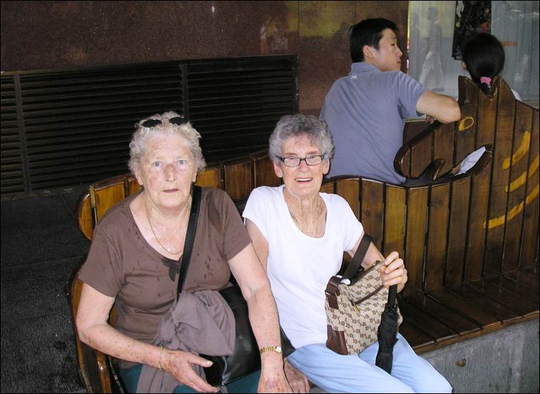 A group of older women sitting on a bench

AI-generated content may be incorrect.