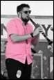 A person playing a clarinet

Description automatically generated with medium confidence