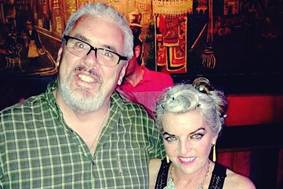 A person and person posing for a picture

AI-generated content may be incorrect.