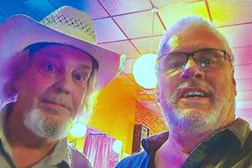 Two men taking a selfie

AI-generated content may be incorrect.