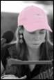 A person wearing a pink hat

Description automatically generated